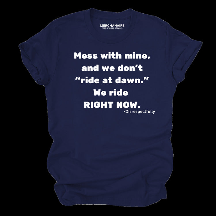 Navy blue t-shirt featuring bold text: ‘Mess with mine and we don’t ride at dawn, we ride right now.’ This protective and empowering design is perfect for those who celebrate melanin pride, unity, and unapologetic strength. Ideal for casual wear, statement clothing, and making a bold impression.