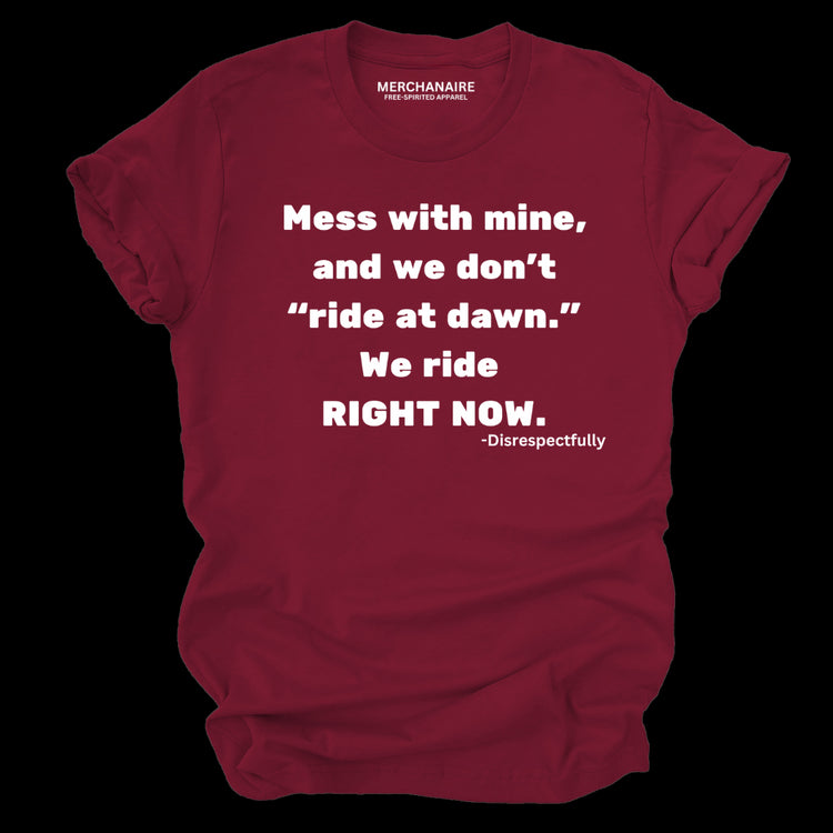 Burgundy t-shirt featuring bold text: ‘Mess with mine and we don’t ride at dawn, we ride right now.’ This protective and empowering design is perfect for those who celebrate melanin pride, unity, and unapologetic strength. Ideal for casual wear, statement clothing, and making a bold impression.
