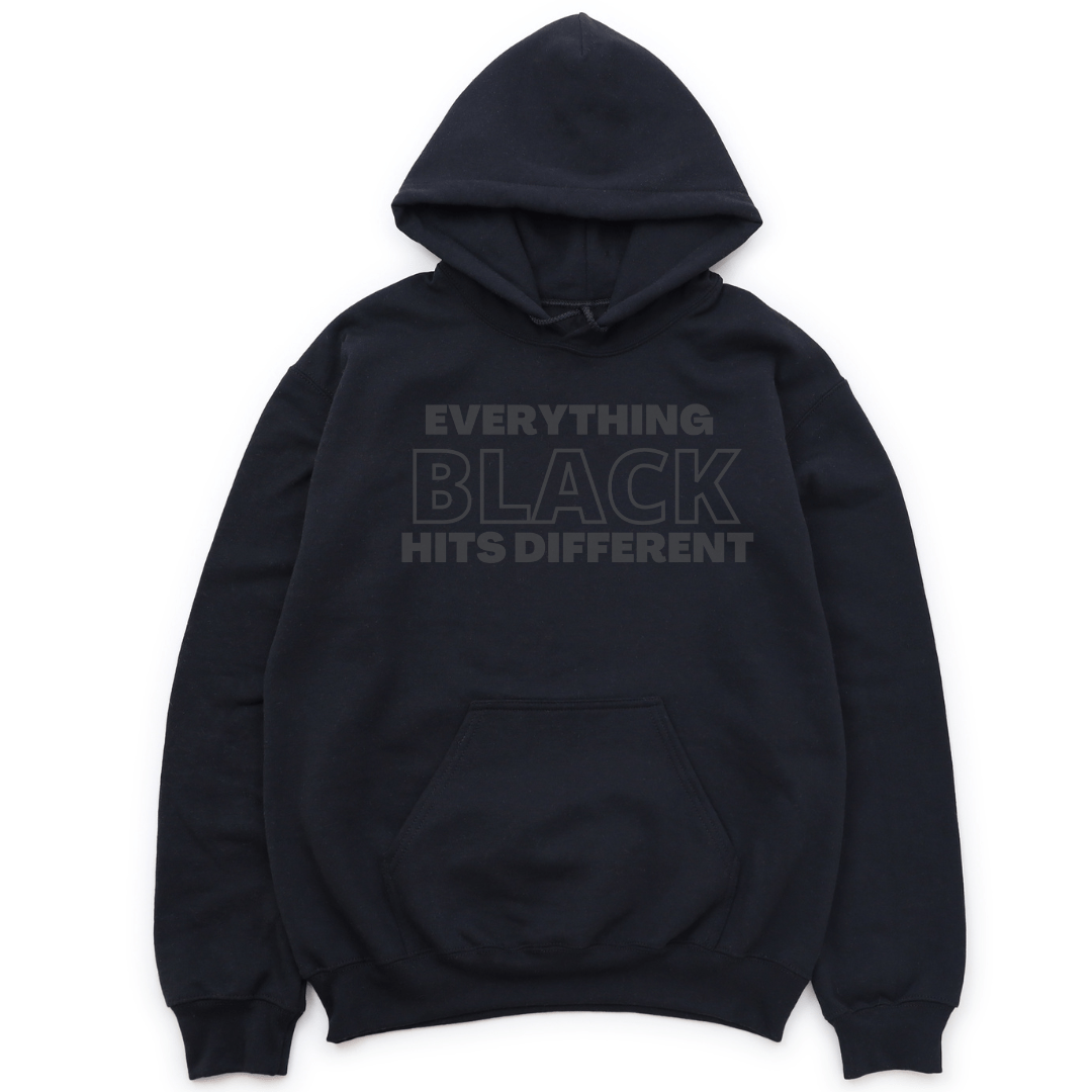 EVERYTHING BLACK HITS DIFFERENT HOODIE - BLACK WITH BLACK LETTERS HOODIE Merchanaire