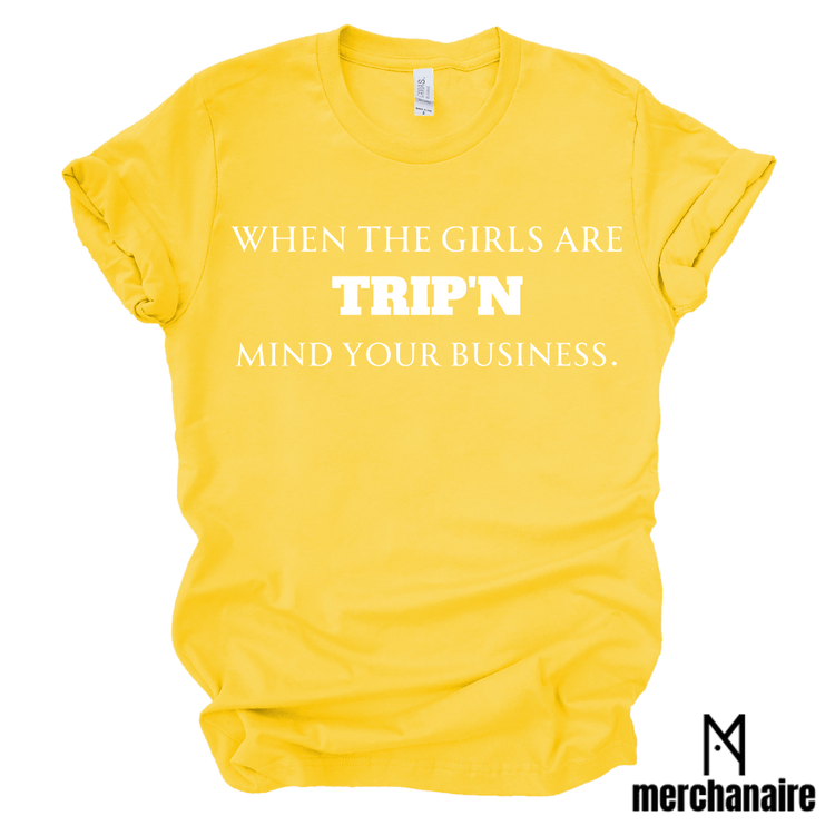 WHEN THE GIRLS ARE TRIP'N MIND YOUR BUSINESS - GOLD T-Shirt Merchanaire